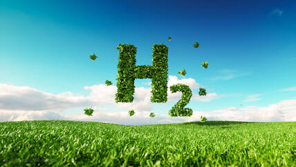 Wasserstoff: Formel H2 schwebend über einem grünen Feld